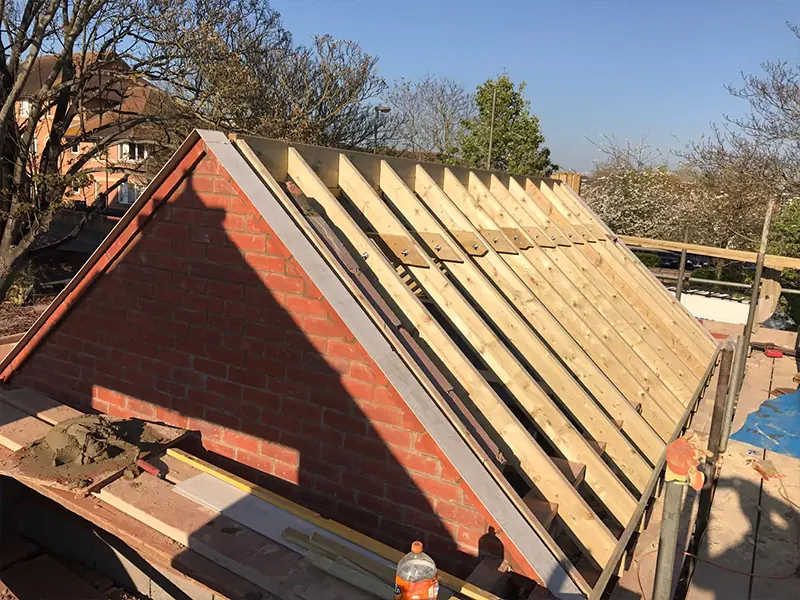 New roof structure being formed on a two-storey extension in Oxfordshire