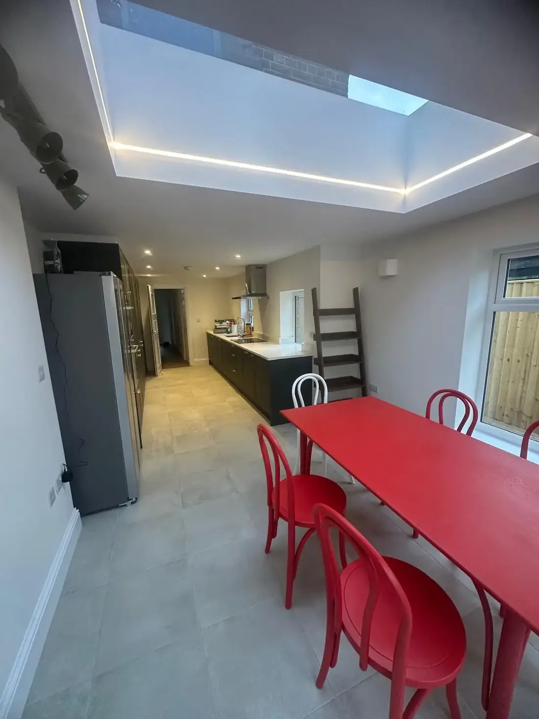 Kitchen and dining space in Oxfordshire lit by a large rooflight